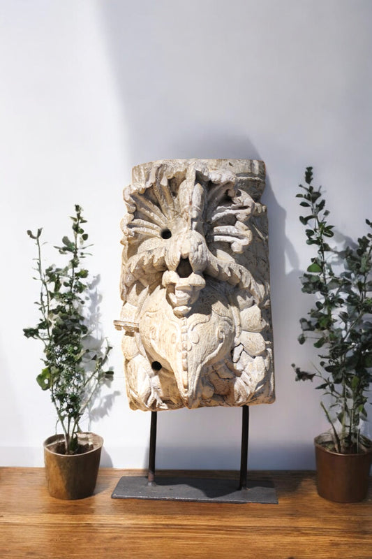 Carved wooden decor with floral and figural design